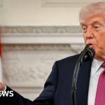 Diplomats discussing the Iran deal during tense diplomatic negotiations.