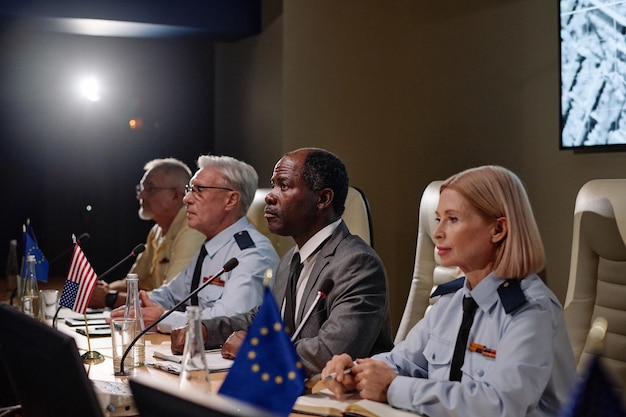 Trump NATO criticism meeting showing serious discussion about global issues.