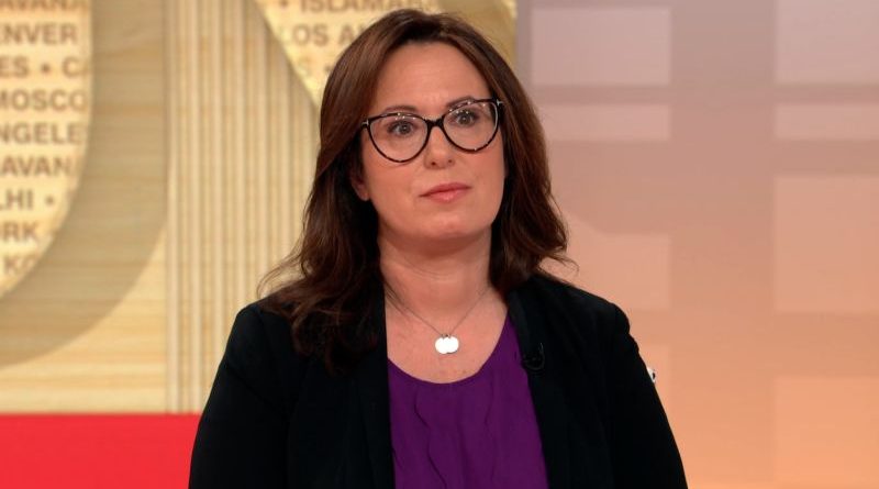 A group of professionals analyzing Trump's judge speech analysis in a conference setting.