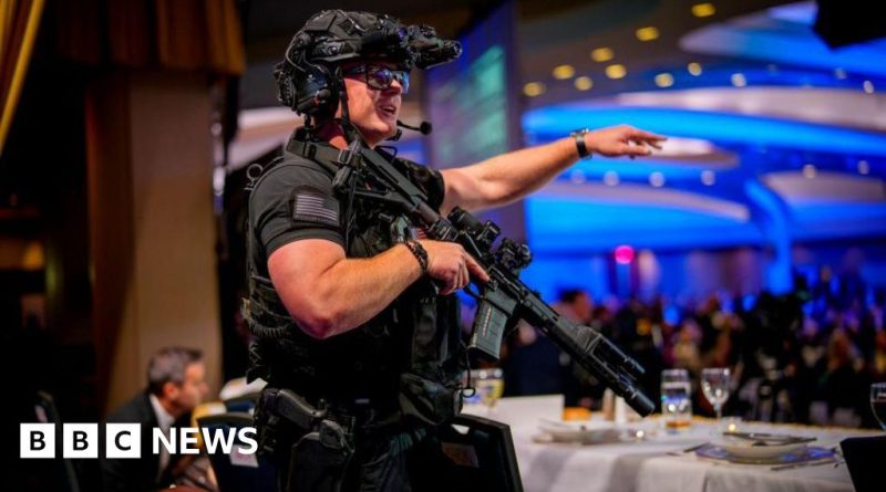 Professionals discussing Trump security challenges at a formal event.