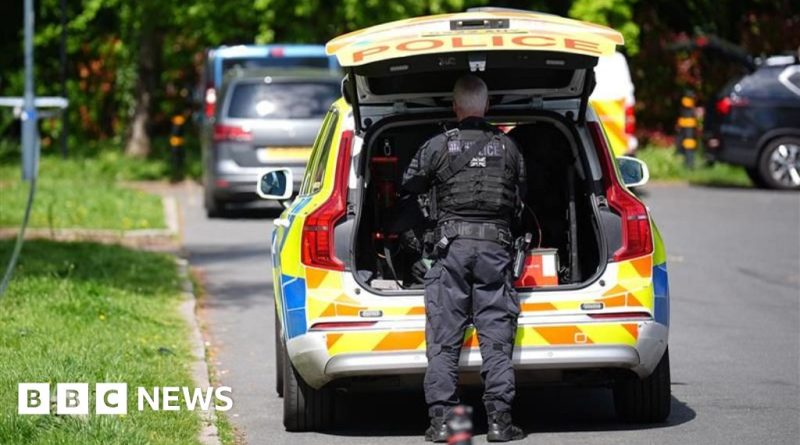 Community members discussing safety measures outside a synagogue after the synagogue attack.