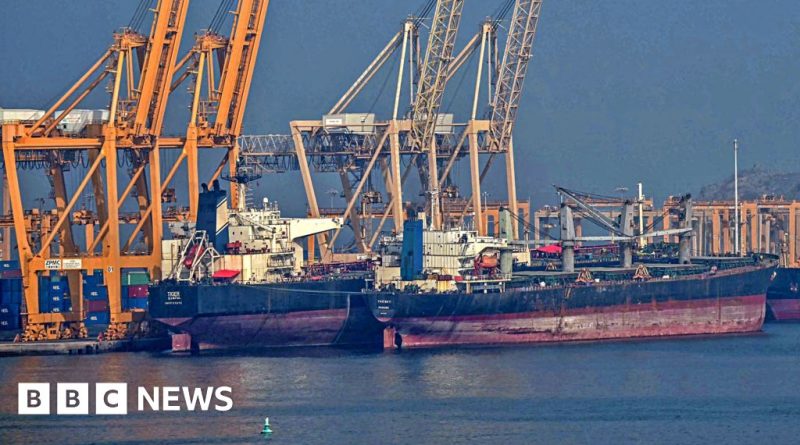 Business professionals discussing UAE's decision to leave OPEC in a modern office.