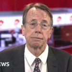 Professionals in a business meeting discussing the UK Biobank data breach.