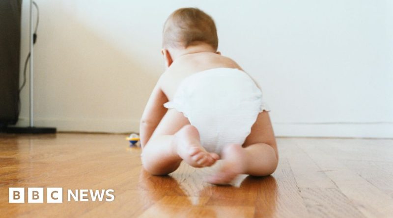 Professionals discussing UK population decline trends at a meeting.