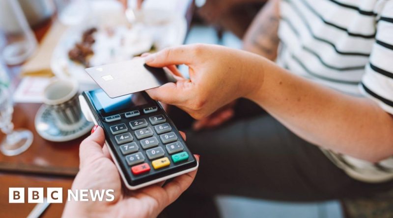 Diverse professionals discussing UK economy impact in an office setting.