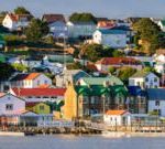 British government officials discussing Falklands sovereignty in a meeting.