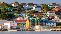 British government officials discussing Falklands sovereignty in a meeting.