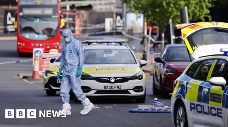 Professionals discussing antisemitism national security in a modern office.