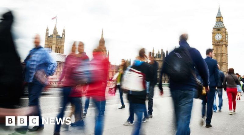 A business meeting discussing UK government borrowing and finances.