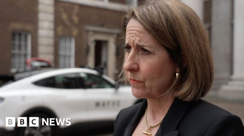 A professional meeting discussing UK AI funding with diverse participants.