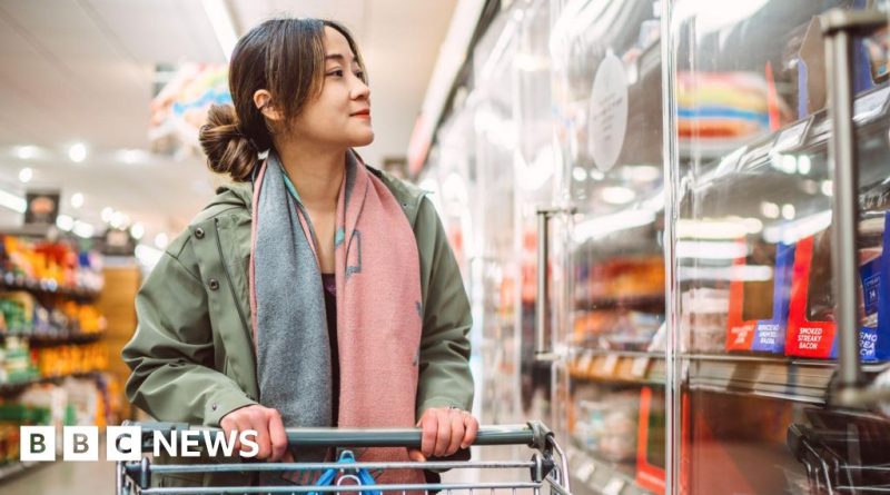 Professionals analyzing supply chain data in a modern office setting, focusing on UK supply chain disruptions.