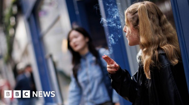 Professionals discussing the UK smoking ban for future generations.