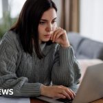 Office scene showing professionals, highlighting the UK unemployment rate.