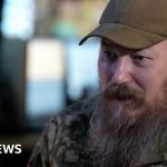 A diverse group of soldiers in a command center, focusing on drone operations as part of Ukraine's drone strategy.