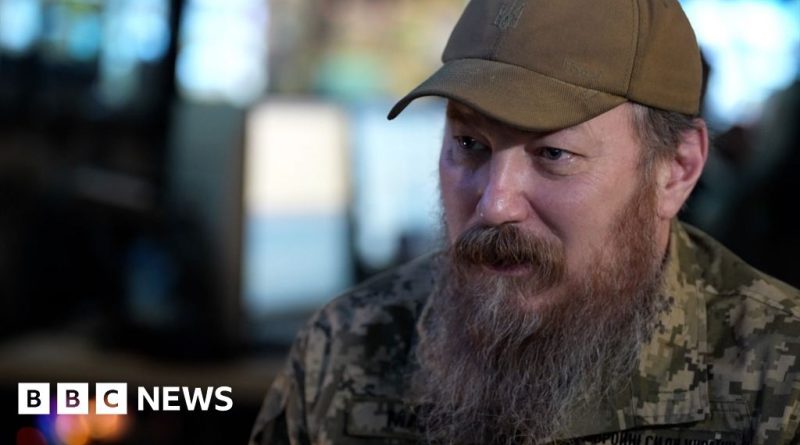 A diverse group of soldiers in a command center, focusing on drone operations as part of Ukraine's drone strategy.