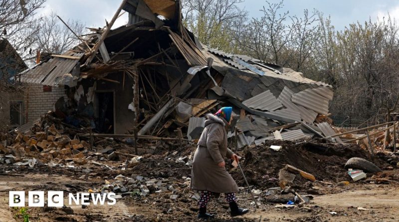 Diplomats discussing Ukraine Russia ceasefire violations in a meeting room.