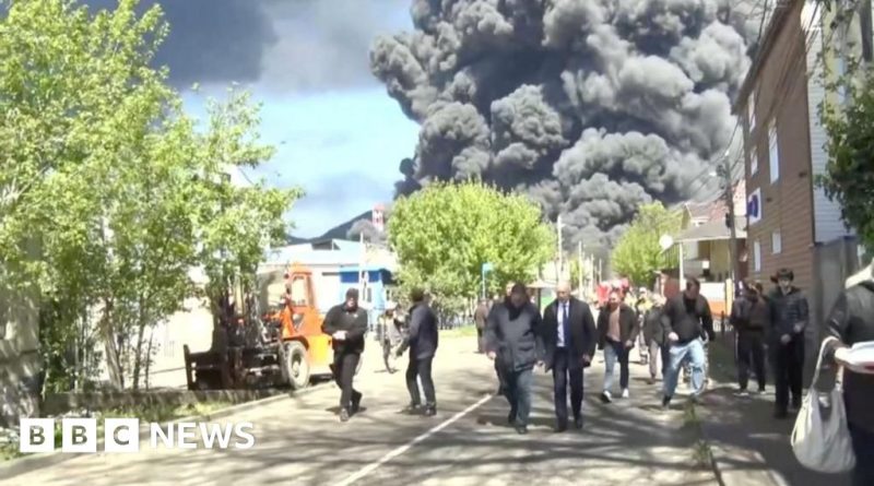 Emergency responders at a Ukrainian strike on a Russian oil facility.