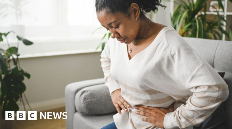 Professionals discussing bowel cancer symptoms and prevention in a modern office setting.