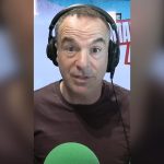 A diverse group discussing energy price cap tariffs in a business setting.