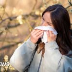 Professionals discussing hay fever symptoms management in an office setting.