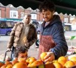 Business professionals discussing recent inflation trends in a meeting.