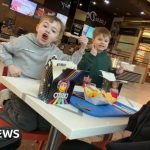 Diverse group discussing OCD recovery stories in a supportive environment.