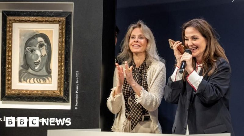 Three people in professional attire react to winning a Picasso painting.