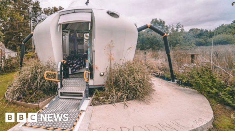 Families enjoying a quirky vacation rental shaped like a spaceship in a scenic location.