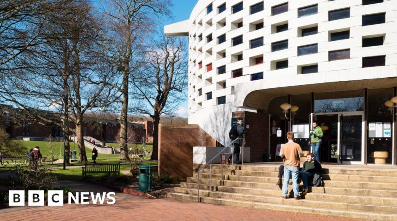 Students engaged in a discussion about free speech policies in a classroom setting.