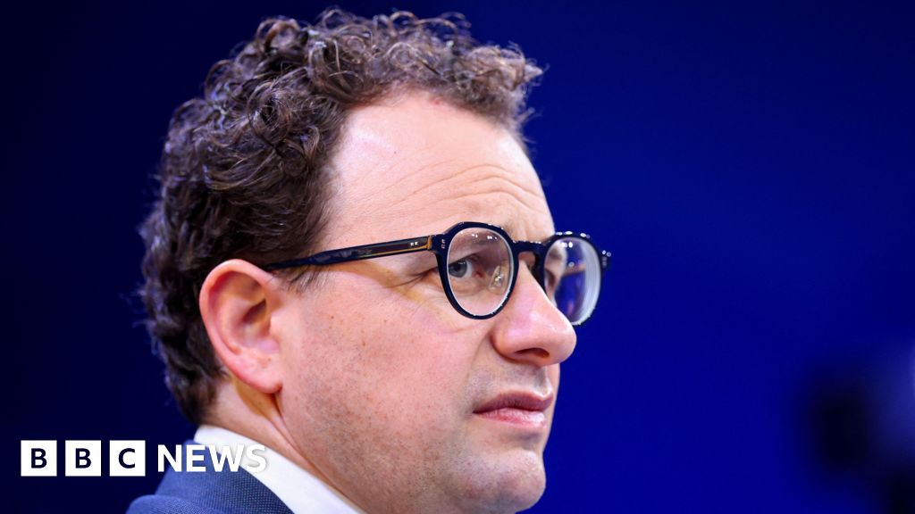 Group of professionals discussing AI technology at a meeting.