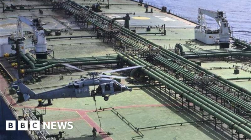 US Navy ship monitoring an Iranian oil shipment in tense waters.