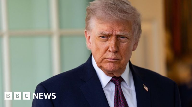 US Navy ship intercepting an Iranian cargo ship at sea during tensions.
