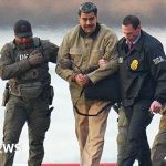 Professionals in business attire discussing US soldier betting charges in an office.