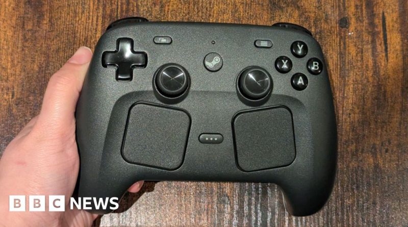 A diverse group of professionals testing a Steam Controller in an office.