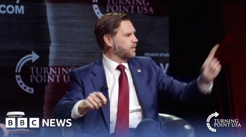 Vance criticism theology at a lively conference with engaged audience.