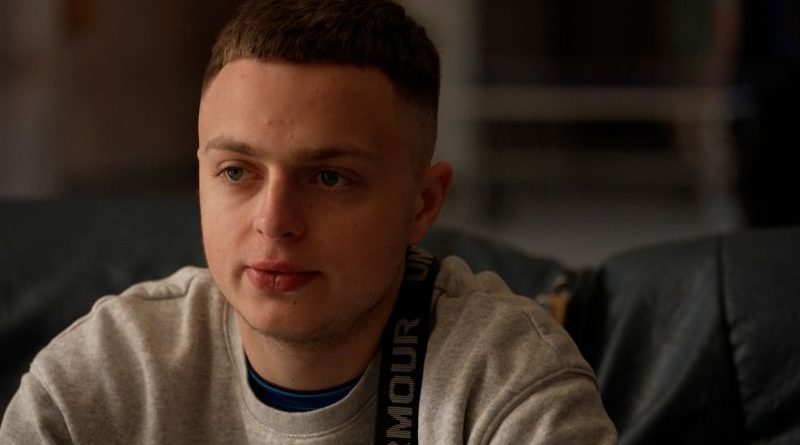 A group of soldiers reflecting on their frontline experience in a war environment.