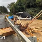 Emergency responders assist residents during Wellington flooding emergency.