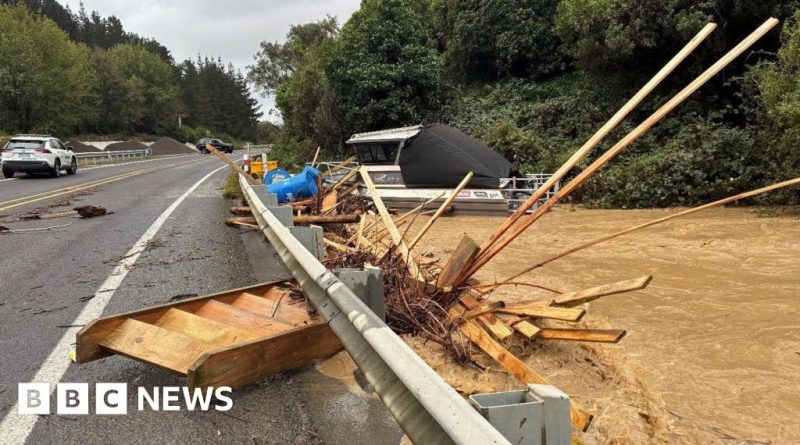 Emergency responders assist residents during Wellington flooding emergency.
