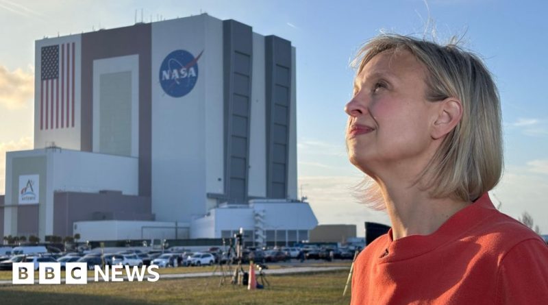 NASA Moon mission control room with engineers monitoring flight data.