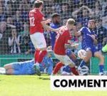 Excited fans celebrating York City promotion goal in a stadium.