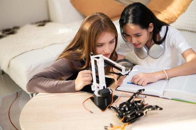 A group of young girls discussing Africa's first private satellite project in a classroom.