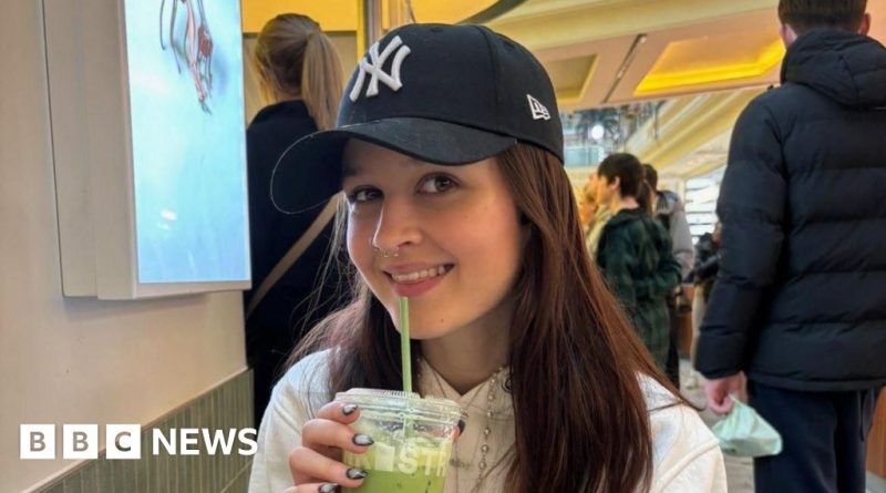 A group discussing wheelchair safety issues in a bar environment.