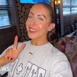 A diverse group of young professionals working together in an office environment.