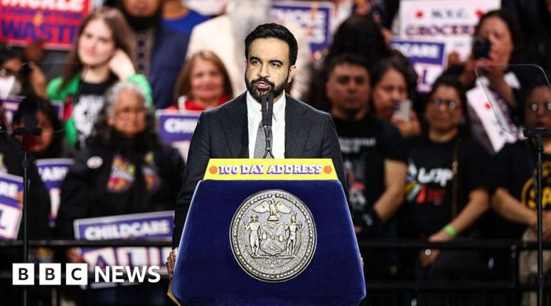 A diverse group discusses city initiatives, highlighting Zohran Mamdani's progress and challenges.