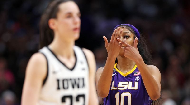 Angel Reese NCAA championship gesture in a basketball celebration scene.