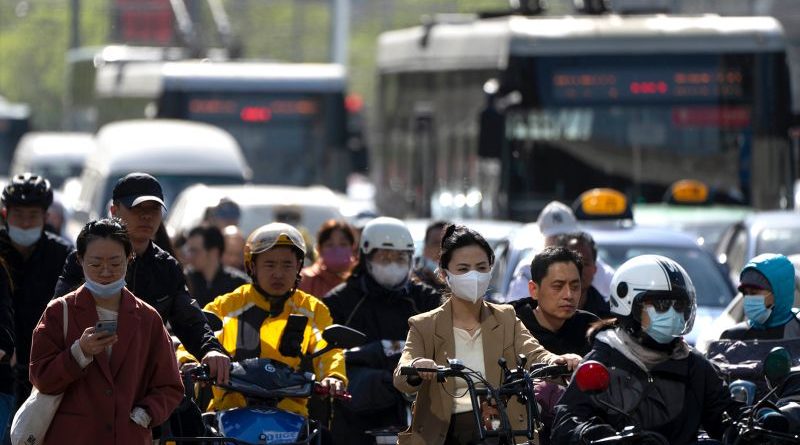 A bustling urban scene in China representing positive China economy growth.