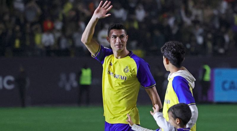 Fans celebrate a football match in Saudi Arabia, highlighting Ronaldo's sports ambitions.