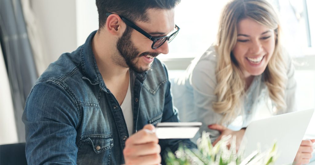 Business professionals discussing 0% interest credit cards in a modern office.