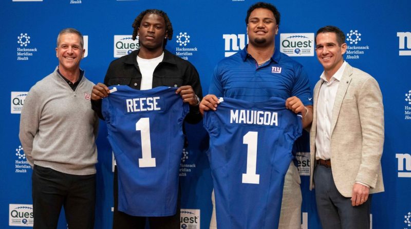 Giants draft strategy featuring strong football players discussing tactics.