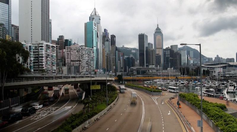 People in professional attire in Hong Kong, reflecting the tourism revival.